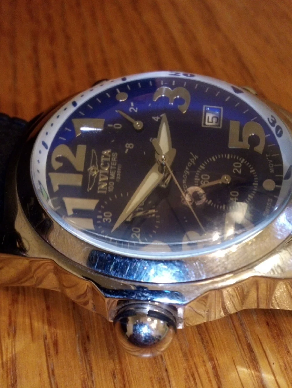 Invicta Blue Dial Watch with Gold Accents and Black Strap